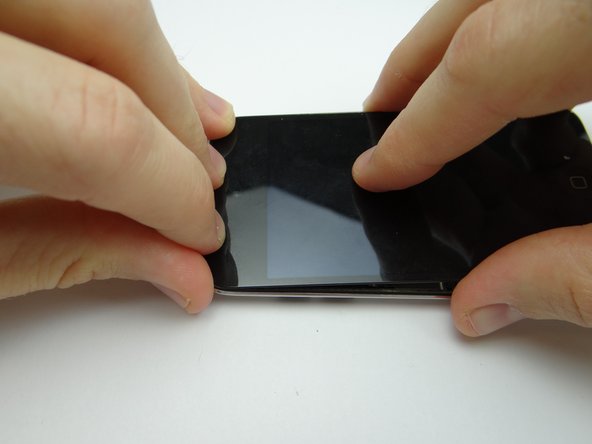 Picture 2: Slide the top edge of the display assembly into the rear case.