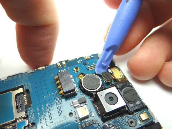 Picture 1: Use blue pry tool to disconnect earpiece speaker / proximity sensor cable.