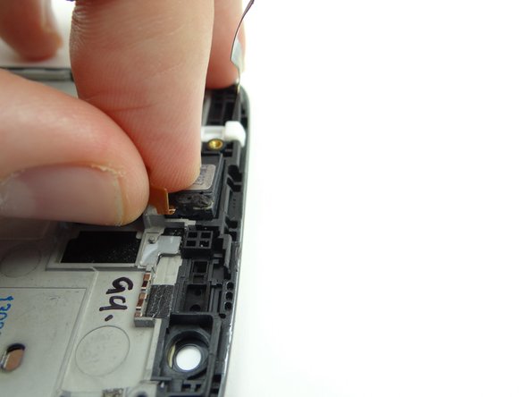 Pinch the cable and slowly peel the earpiece speaker from its socket.