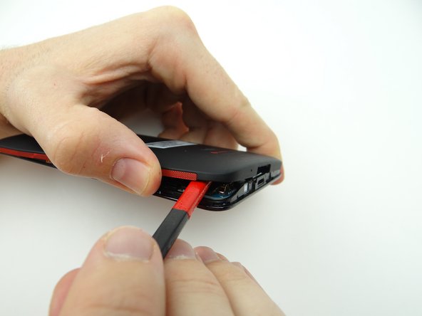 Picture 2: You may have to use the flat end of the spudger to cut through the adhesive on the speaker.