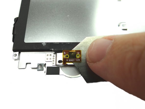 Picture 2: From the underside of the metal plate, use the iSesamo to peel up the home button contact pad.