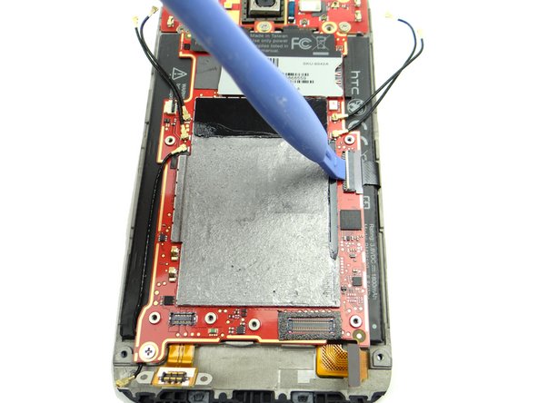 Picture 1: Use the blue pry tool to open the LCD cable ZIF connector.
