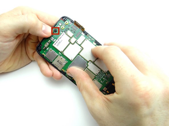 Picture 3: Feed the standoff at the bottom of the display through the opening on the logic board.  Gently push the center of the logic board into place.