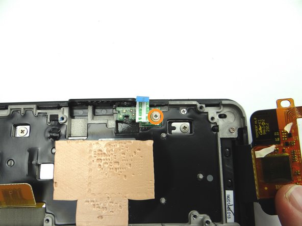 Remove the 2.5 mm Phillips scew securing the power button cable.  Place screw in SLOT 4.