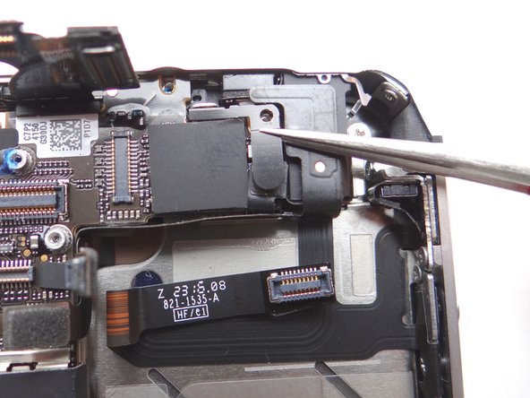 Picture 2: Remove the shield with your fingers or Fine Point Tweezers, if needed. Place with the Phillips screw in SLOT 9.