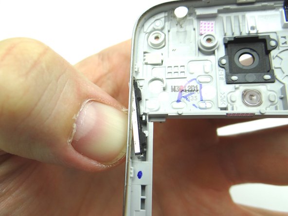 Picture 1: Push volume rocker towards the inside of the mid-frame.