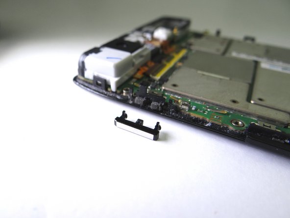 Retrieve power button from COMPARTMENT B: