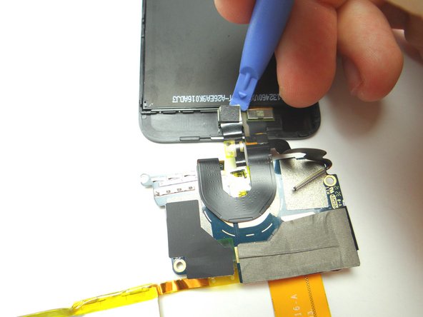 Flip over the logic board and battery.  Disconnect front-facing camera.