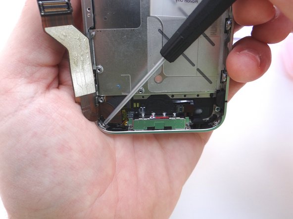 Stabilize the phone while you're removing the screws by holding it as in Picture 2.