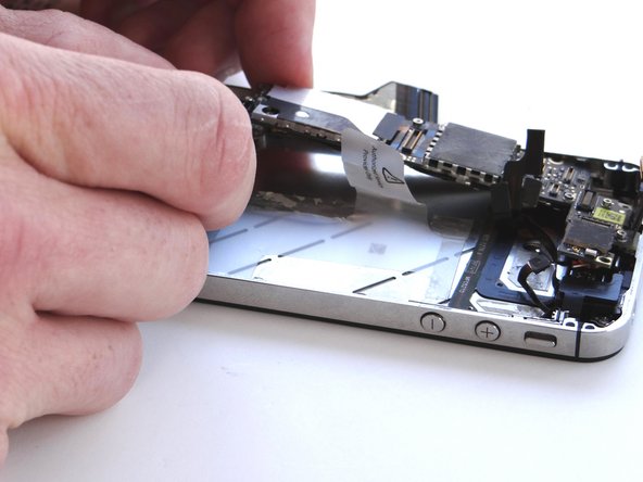 Picture 1: Grab the logic board from ZONE III and carefully position the top edge into the mid-frame.  Make sure the top edge is below the protruding tab on the mid-frame.