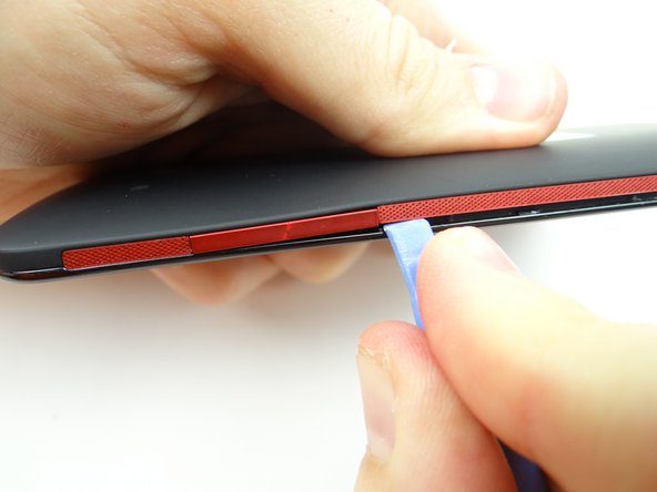 Remove the pry tool when you reach the volume rocker.