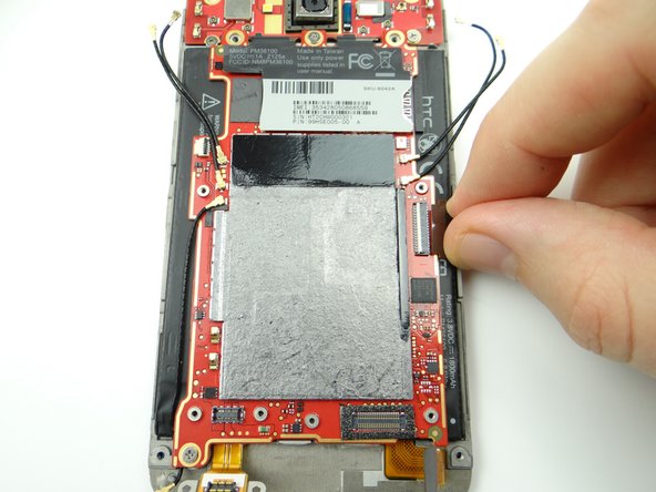 Picture 2: Use your fingers to pull the LCD cable free.