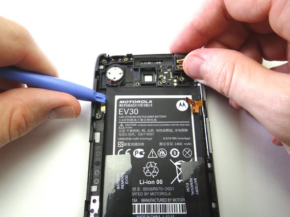 Picture 2: Start lifting the battery in the upper-left corner with blue pry tool.  Work your way down the left side.