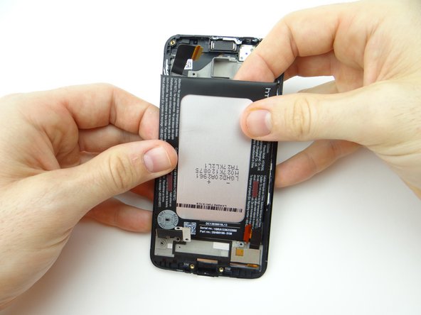 Picture 3: Carefully peel the battery up from the top with your fingers.