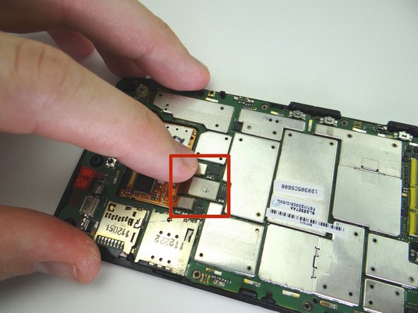 Connect the three display assembly ribbon cables to the logic board with your finger.