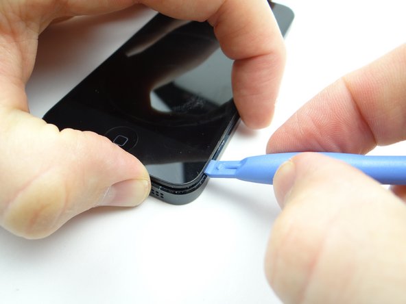 Picture 1: Insert the blue pry tool in the lower-right corner, then twist to pry the front panel up from the rear case.