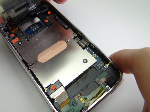 Picture 3: While holding the front panel at a 45° angle, wedge spudger under cable '1' and rotate counter-clockwise until cable head is free.