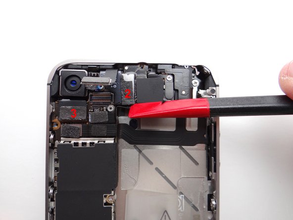 Be careful not to break any components off the surrounding area on the logic board as you pry upwards.