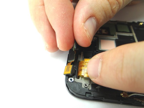 Use your fingers to remove the front-facing camera/sensor assembly and place into COMPARTMENT B.