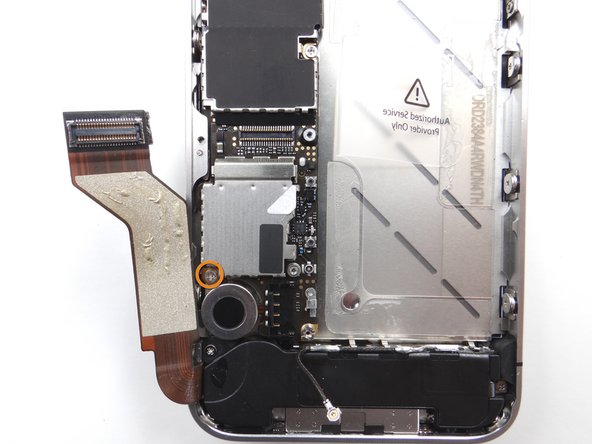 Picture 1: Remove the 2.5 mm Phillips screw near the vibrator motor. Place in SLOT 12.