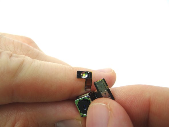 Reconnect the rear camera ribbon cable to the underside of the logic board.