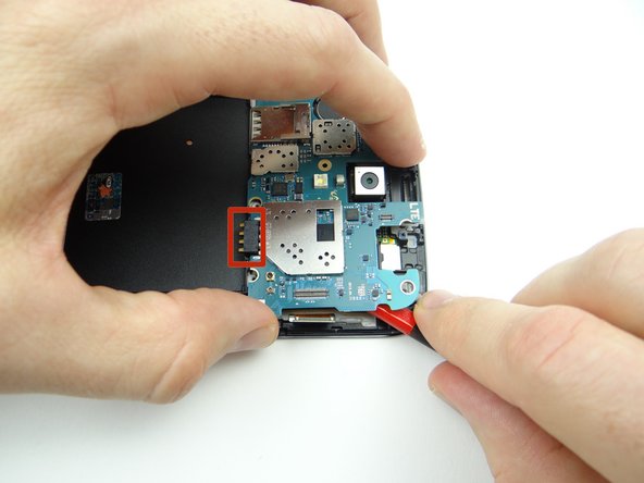 There is a small amount of adhesive under the battery contact (red square in Picture 1):