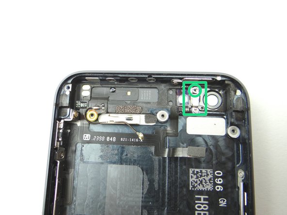 Picture 3: Remove one 2.9 mm Standoff screw and place in COMPARTMENT C. Remove the metal bracket and place in COMPARTMENT E.