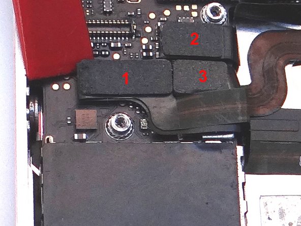 Release three cables just below the camera slot using the Black Spudger to gently lift the connectors up and out of the sockets.