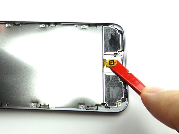 Picture 2: Use the spudger to peel up the home button contact.
