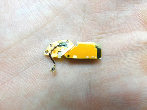 Gently peel the antenna up from its foam adhesive backing.  Place in COMPARTMENT F.