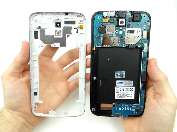 From ZONE V, seat the mid-frame on the phone: