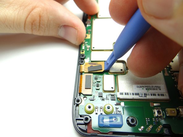 Picture 1: Use blue pry tool to disconnect digitizer cable.