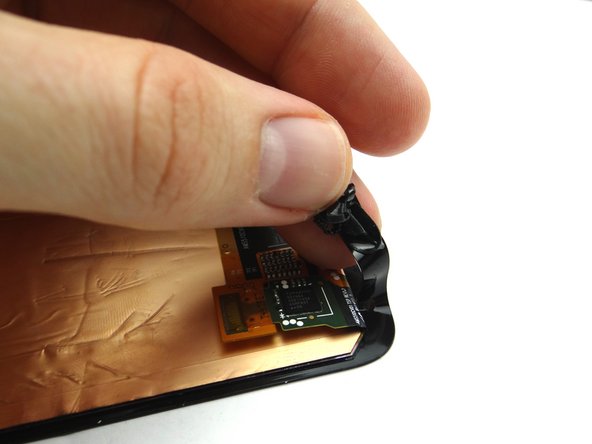 If you're reusing the screen: use the blue pry tool and your fingers to peel up the adhesive covering the perimeter of the underside of the screen.