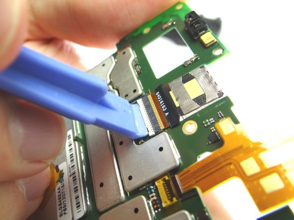 Picture 2: Open cream colored rear camera ZIF connector bar.