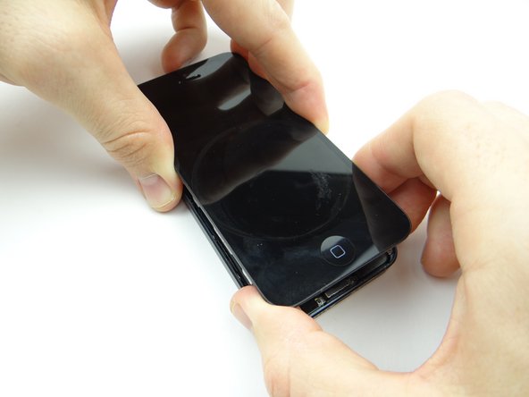 There are three ribbon cables still attached at the top of the iPhone: do not lift the front panel past an 80° angle: