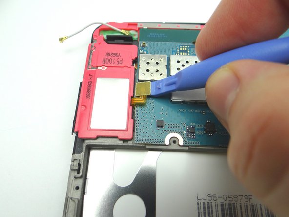 Picture 2: Use blue pry tool to disconnect loudspeaker from logic board.