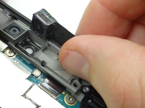 Push rear camera into its socket on the bracket.