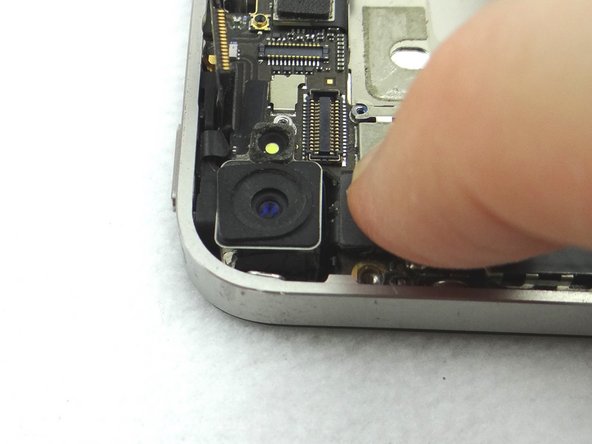 Picture 1: Replace Rear Camera from COMPARTMENT C (or replacement part). Push connector into socket on logic board.