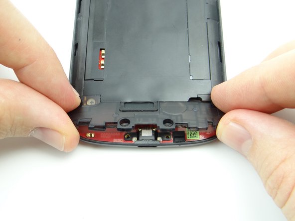 Position top edge first then push speaker assembly fully into place.