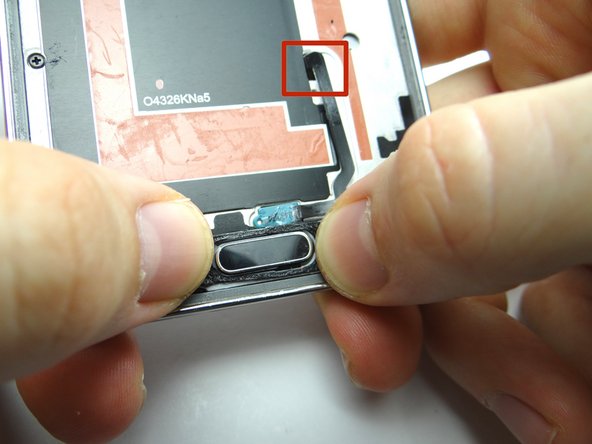 Picture 3: Seat the home button from COMPARTMENT C: first feed home button cable through mid-frame, then position home button on mid-frame.