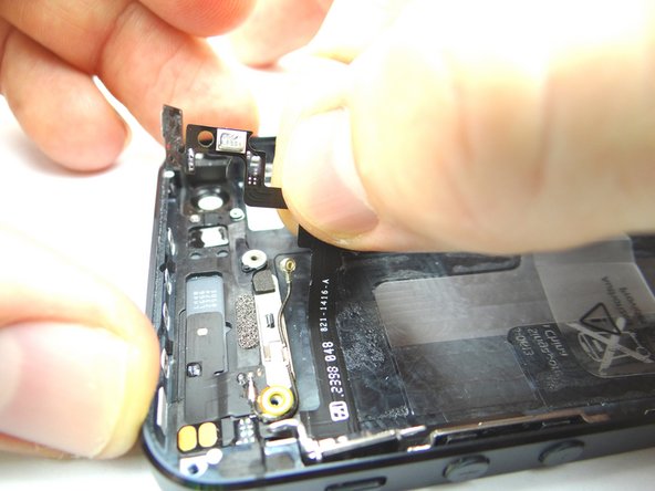Picture 1: Use your fingers to start replacing the ribbon cable to the rear case, starting from left to right.