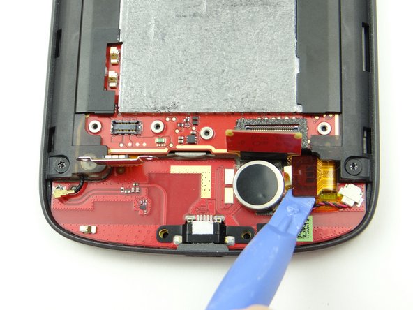 Picture 1: Use the blue pry tool to disconnect soft keys/digitizer cable.