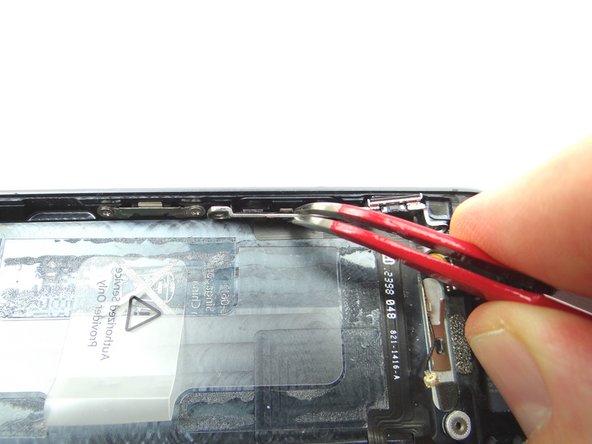 Picture 2: Use Curved Tip Tweezers to move the volume buttons into position.