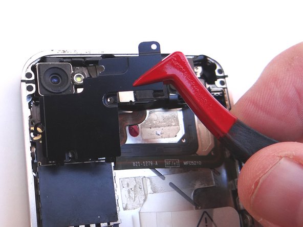 Using your fingers (or plastic tweezers if needed), grab the top-right of the Cable Shield.  Gently lift the shield 25 degrees.