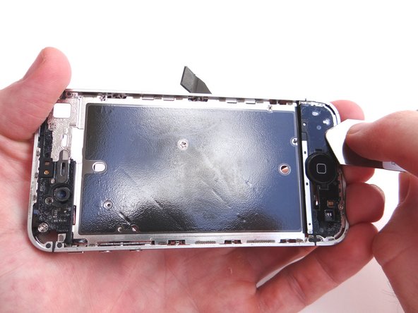 Examine the top side of the mid-frame for glass shards and bits of adhesive.  Use the iSesamo to scoop up and remove them.