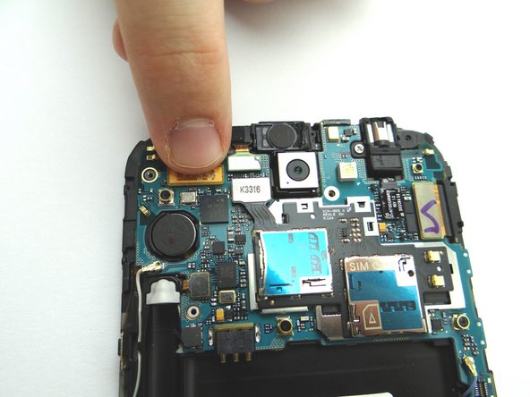 Reconnect the seven ribbon cable connectors to the logic board.