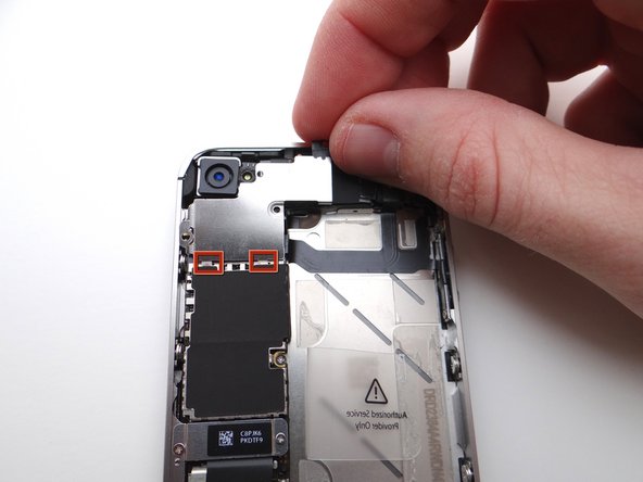 Using your fingers (or plastic tweezers if needed), grab the top-right of the Cable Shield. Gently lift the shield 25 degrees.