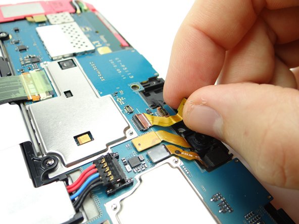 Picture 2: Lift front camera from its socket, then away from the ZIF connector.