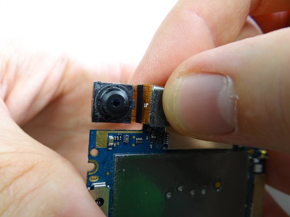 Replace rear camera on underside of logic board from COMPARTMENT B.