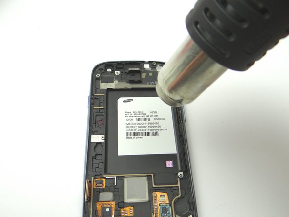 Apply heat to the IMEI sticker for approximately 20 seconds to loosen the adhesive.